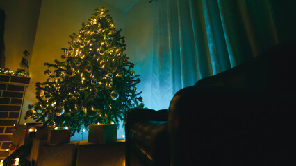 Christmas Tree Silhouette in the Living Room at Night