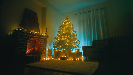 Christmas tree in a large room with fireplace and sofa