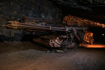 Old drilling jumbo in underground mine