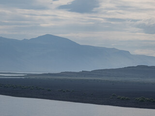 island, shore and rocks on the seashore in iceland