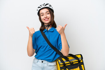 Young Ukrainian woman with thermal backpack isolated on white background with thumbs up gesture and smiling