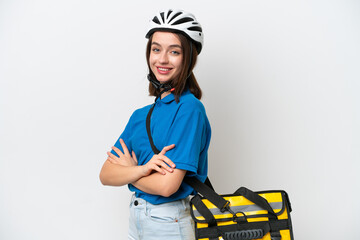 Young Ukrainian woman with thermal backpack isolated on white background with arms crossed and looking forward
