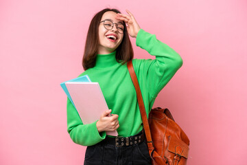 Young student Ukrainian woman isolated on pink background smiling a lot © luismolinero