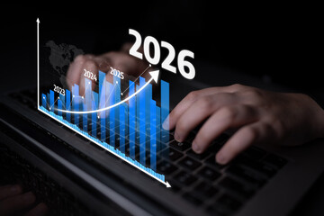 This image features hands on a laptop keyboard, overlaid with a dynamic growth graph illustrating...