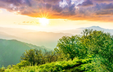 beautiful mountain sunset landcape with great magestic mountains and amazing slopes and canyons with evening clouds. Panorama of vulcano Etna in Sicily, Italy.