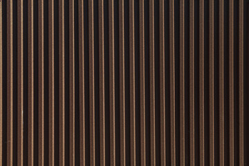 Obraz premium Black metal fence. Corrugated sheet or profiled sheet. Front. Metallic background. Striped textured backdrop