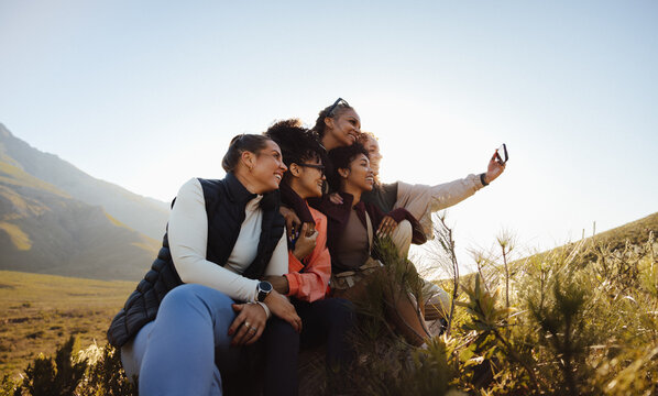 Friends taking a selfie outdoors