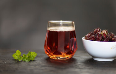 Hibiscus sabdariffa (roselle) fruits are bright red, tangy, antioxidant-rich calyces used in beverages and foods.
