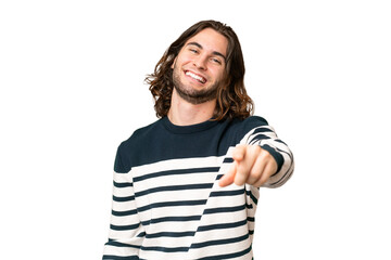 Young handsome man over isolated background pointing front with happy expression