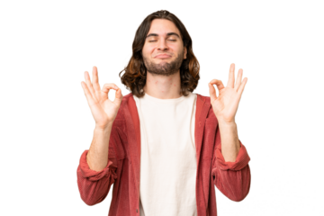 Young handsome man over isolated background in zen pose