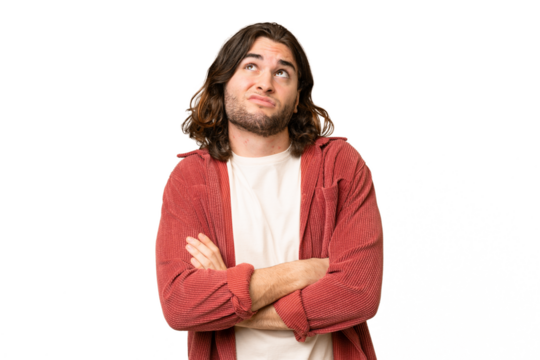 Young handsome man over isolated background making doubts gesture while lifting the shoulders - Powered by Adobe