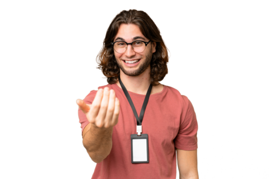 Young handsome man with ID card over isolated background inviting to come with hand. Happy that you came