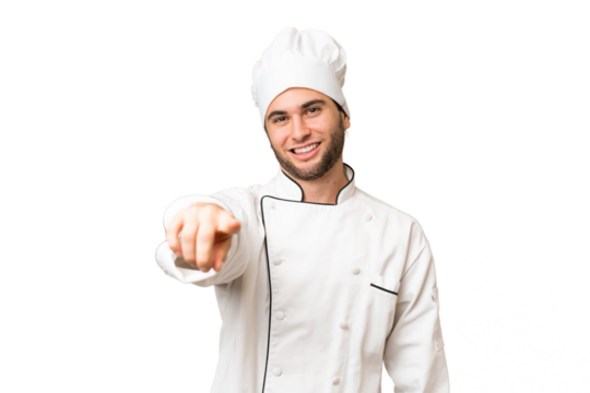 Young handsome chef man over isolated background points finger at you with a confident expression