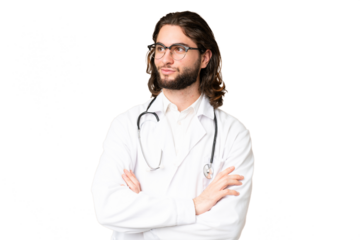 Young handsome man over isolated chroma key background wearing a doctor gown and with arms crossed looking side