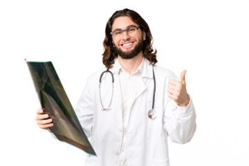 Young handsome man over isolated chroma key background wearing a doctor gown and holding a bone scan