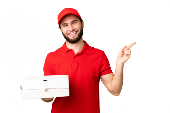 pizza delivery man with work uniform picking up pizza boxes over isolated chroma key background pointing finger to the side