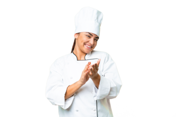 Young woman Chef over isolated chroma key background applauding after presentation in a conference
