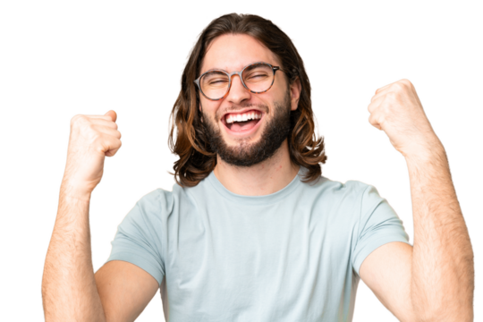 Young handsome man over isolated chroma key background With glasses and celebrating a victory