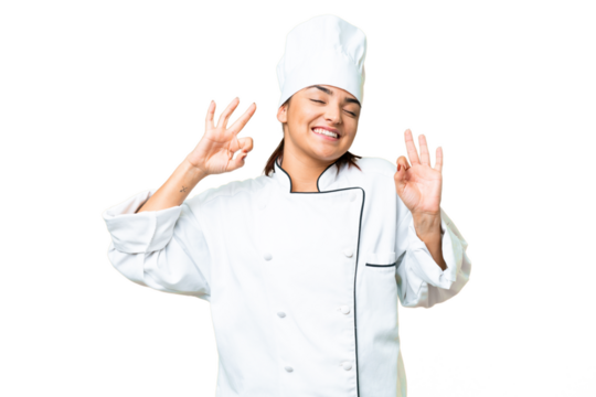 Young woman Chef over isolated chroma key background in zen pose