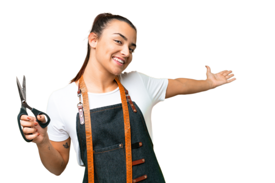 Seamstress woman over isolated chroma key background extending hands to the side for inviting to come