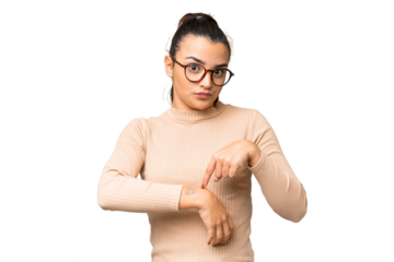 Young beauty woman over isolated chroma key background making the gesture of being late