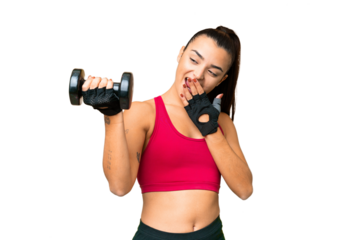 Young sport woman making weightlifting with surprise and shocked facial expression