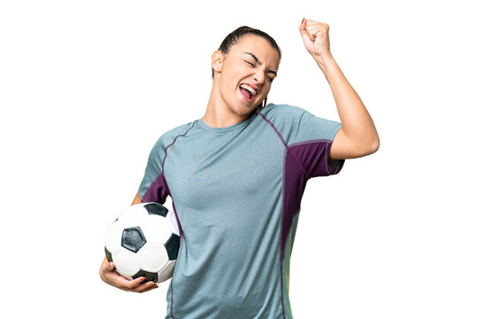 Young football player Woman over isolated chroma key background celebrating a victory