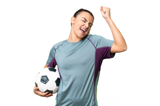 Young football player Woman over isolated chroma key background celebrating a victory