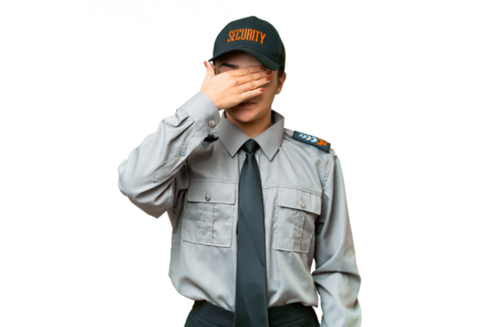 Young safeguard woman over isolated chroma key background covering eyes by hands. Do not want to see something