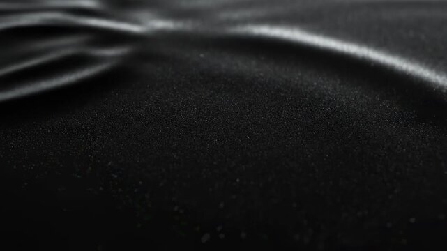 Ethereal Black Fabric: A textured expanse of sleek black fabric with flowing patterns and subtle sheen, creating an air of sophistication. 
