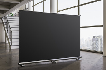 Fototapeta na wymiar Blank black banner display in modern office hallway with city view through large windows and stairway in background. 3D Rendering