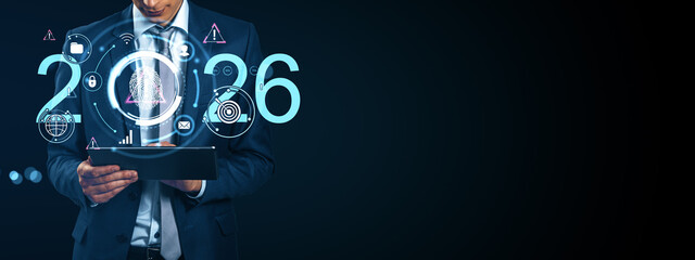 Businessman using tablet with futuristic digital interface and biometric fingerprint scan concept for 2026 cybersecurity and innovation vision.