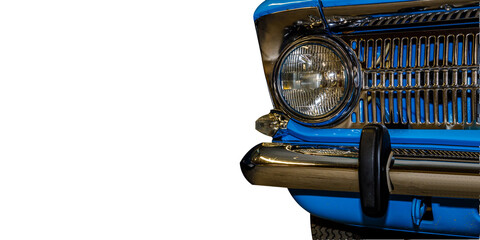 Close-up of a blue car's front end