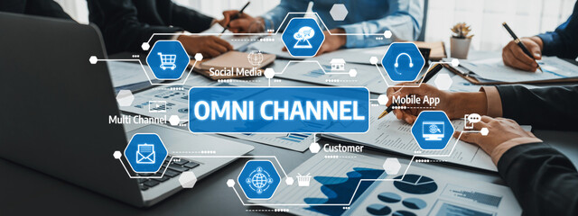 This image illustrates a collaborative business meeting focusing on omni channel marketing strategies. It showcases various digital elements enhancing customer engagement and interaction. Amity