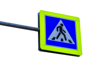 A blue and yellow pedestrian crossing sign on a street pole, perfect for traffic safety and infrastructure images
