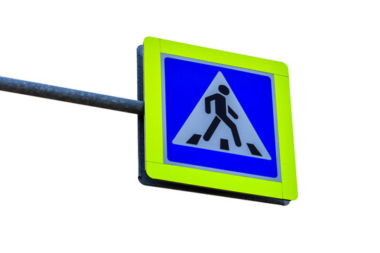 A blue and yellow pedestrian crossing sign on a street pole, perfect for traffic safety and infrastructure images - Powered by Adobe