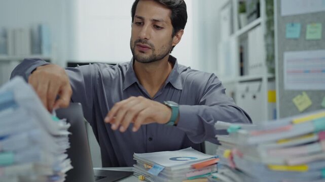 Exhausted executive struggling with an overloaded workload, feeling stressed and unhappy, contemplating support for burnout and mental health issues.
