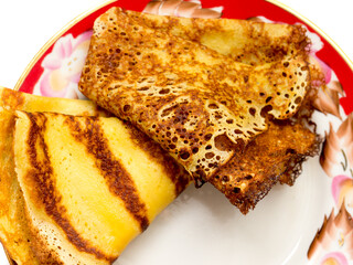 Pancakes lying on a plate.