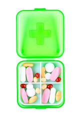 Green plastic pill container on white