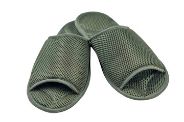 A pair of green soft hotel slippers on white