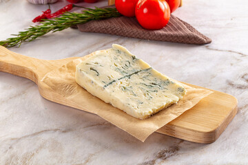 Tasty Italian gorgonzola cheese over board