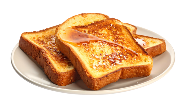 Plate of French toast covered in syrup and powdered sugar