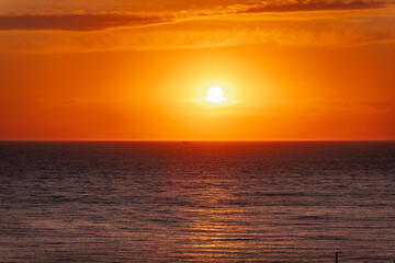 Obraz premium Beautiful red and orange sunrise over the sea.