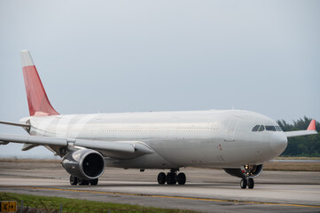 Wide body aircraft taxiing on the runway