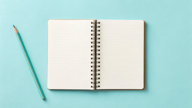 Open notebook with blank pages and a turquoise pencil on a teal background ready for ideas and creativity