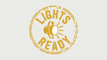 A yellow circular stamp with the words lights ready and a spotlight in the center on a white background