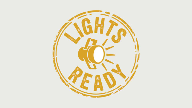 A yellow circular stamp with the words lights ready and a spotlight in the center on a white background