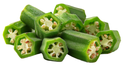 A close up shot of sliced okra pieces stacked on top of each other against a black background studio shot