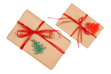 Two gift boxes made of brown kraft-paper with red ribbons and wooden tags shaped like Christmas trees.