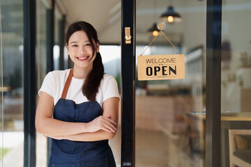 Small business owner standing proudly welcoming customers